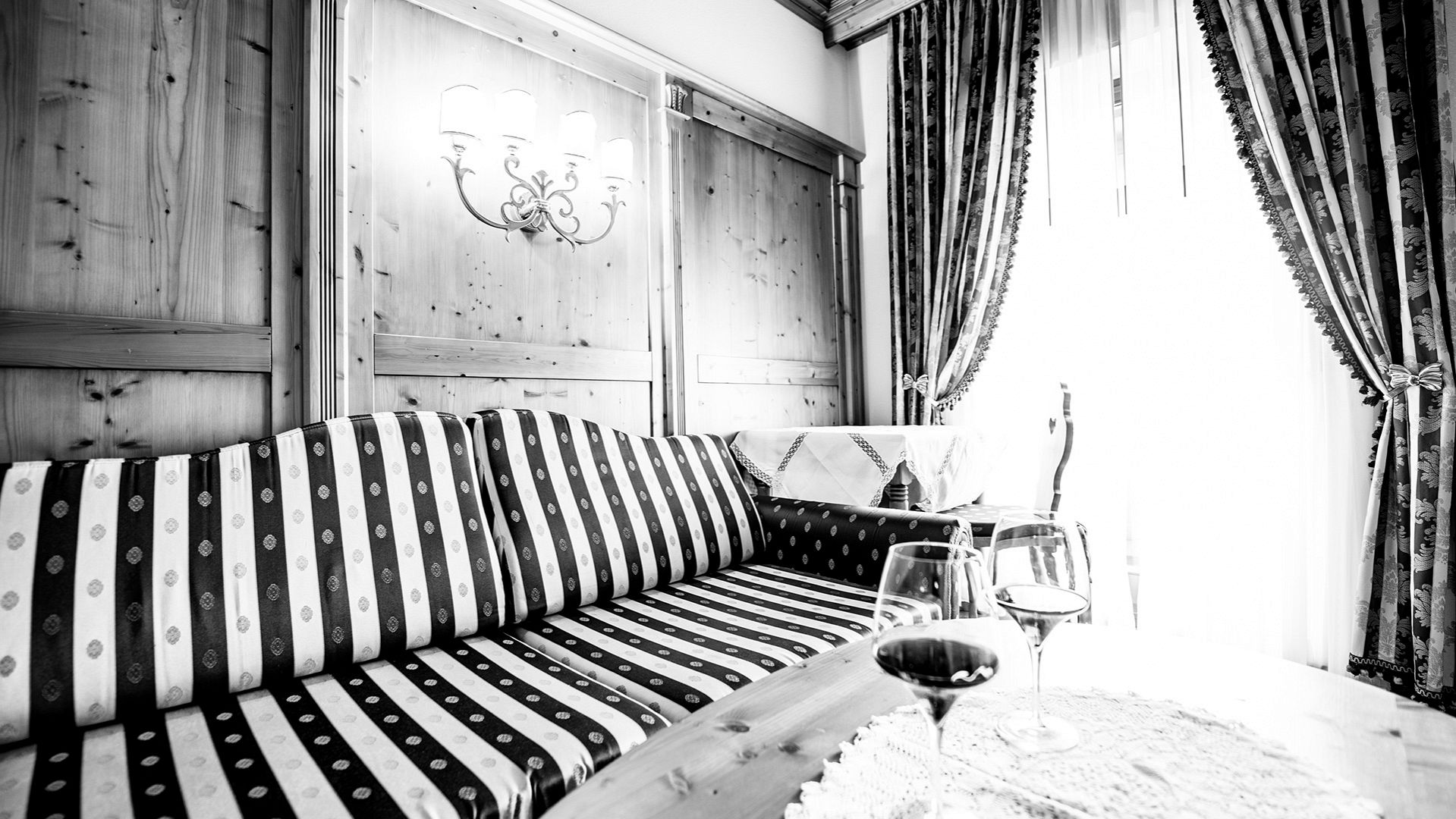 sofa in the room Hotel Genziana South Tyrol